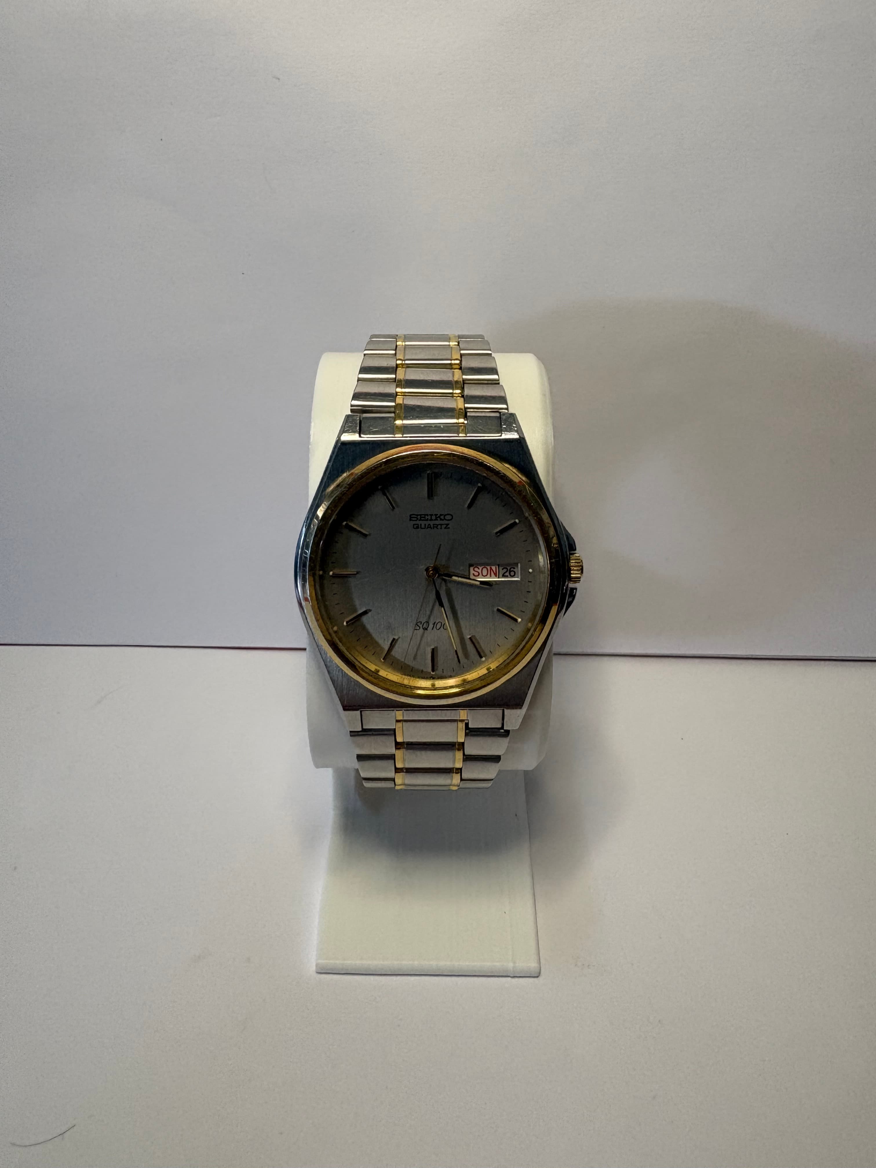 Montre Seiko SQ 100 quartz Vintage bicolore